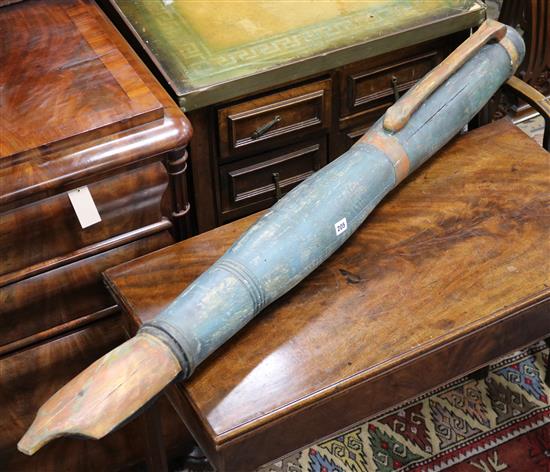 A large carved wood advertising fountain pen